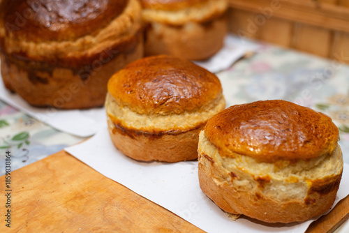 Wallpaper Mural Freshly baked homemade bread loaf with golden crust on table Torontodigital.ca