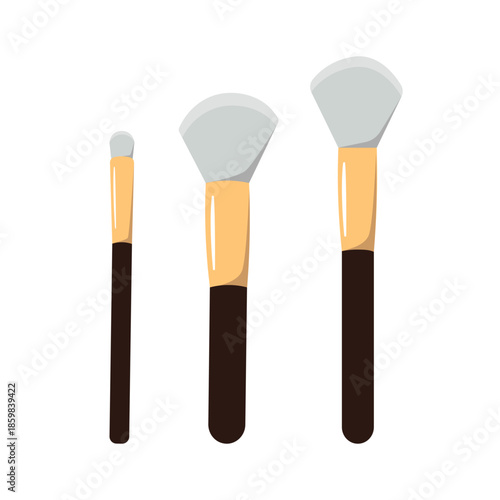 three makeup brushes on a white background