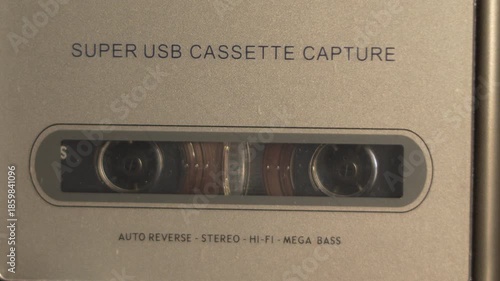  Small black and white cassette player and small headphone