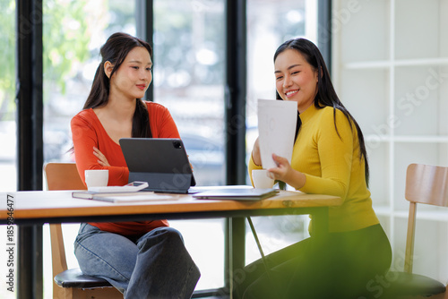 Free Download Two asian business women planning and strategy about marketing and financial with colleagues looking laptop, meeting and working on laptop computer with partner, business and consulting.
 - GFXLoad