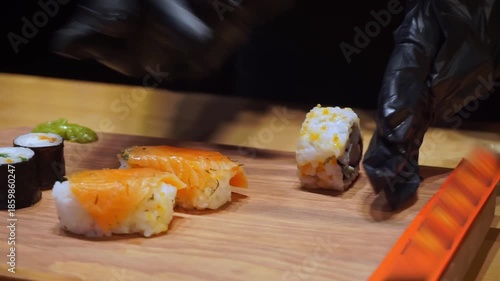 Prepared Sushi Being Placed on Presentation Board