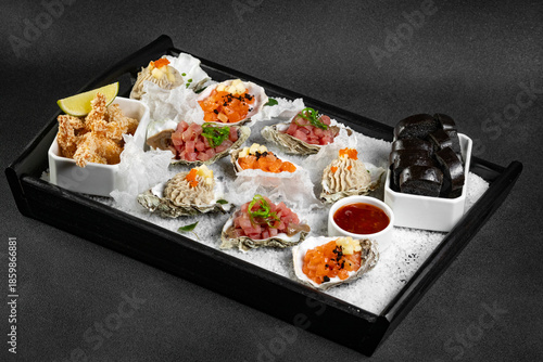Healthy food. Seafood and toast in a frying pan on a wooden board on a black background.