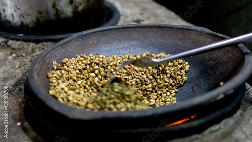Roasting coffee in the traditional way and using pottery (Indonesian call it kreweng)