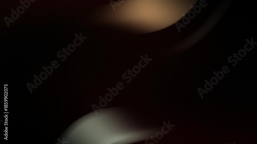 Abstract flowing light streaks in dark background motion blur.