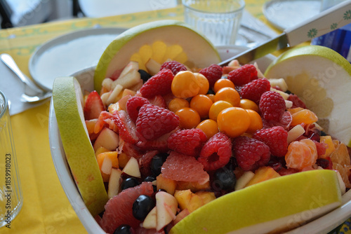 Vibrant Mixed Fruit Salad with Raspberries and Goldenberries in a Bowl