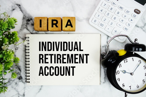 Tableau sur toile IRA Individual Retirement Account text with calculator and alarm clock on marble
