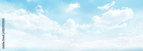 Bright, clear blue sky with soft white clouds floating above a misty, light horizon, creating a fresh, airy, and optimistic backdrop that feels pure, spacious, and wonderfully free

