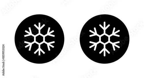 Snowflake icon in black circle. Winter season, ice, and cold temperature symbol