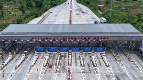 Aerial View of Highway Toll Gate with Vehicles Passing Through