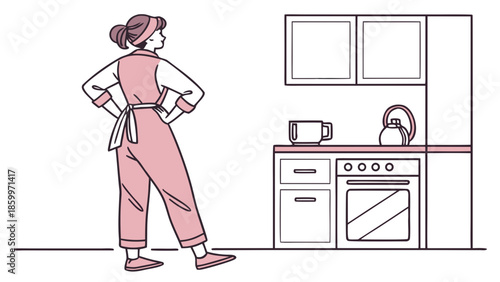 Woman in apron standing in a kitchen with hands on hips, looking at the counter and stove.