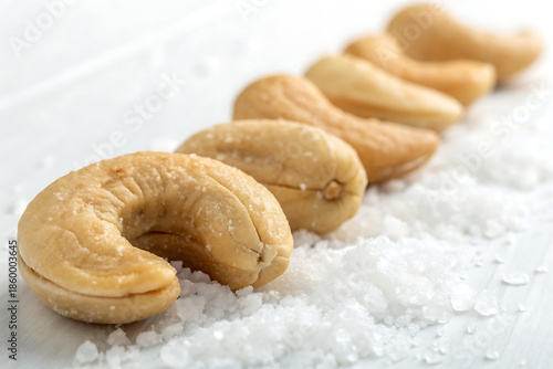 Salted cashew nuts macro, clean white backdrop