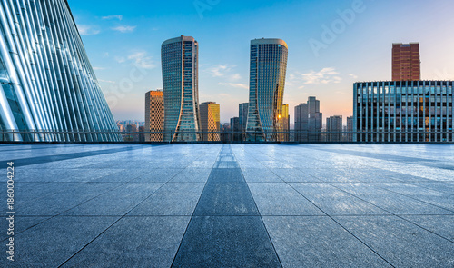 Wallpaper Mural Empty square floor and modern city skyline with office buildings at sunrise in Hangzhou Torontodigital.ca