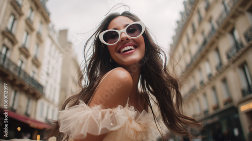 Wallpaper Mural Fashionable woman enjoys a sunny day in city on a charming street Torontodigital.ca