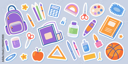 Colorful school supplies scattered against a light blue background ready for learning