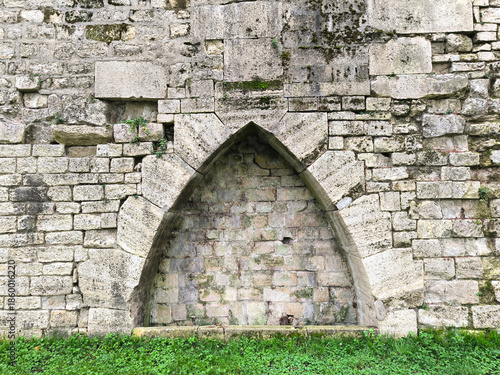 ogival niche in stone wall