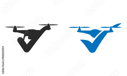 Black and blue drone with camera flying over a landscape