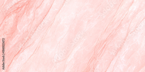 A delicate and abstract close up view of a pale coral pink marble texture displaying natural veining