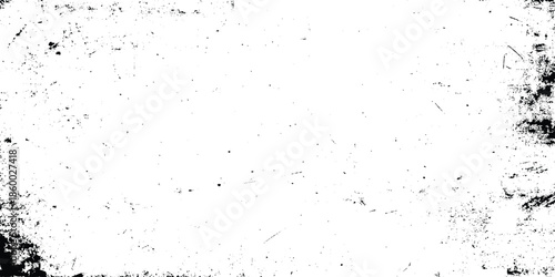 A distressed textured white background with dark speckles and a grunge aesthetic perfect for overlays and design elements