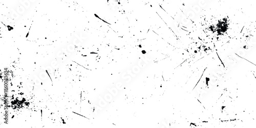 A textured abstract grunge background featuring scattered dark specks and linear scratches on a predominantly white surface