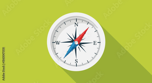 A classic compass with a red and blue needle points the way on a vibrant green background with a long shadow, symbolizing guidance and direction