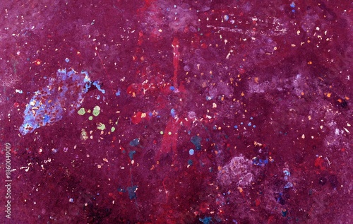 Abstract paint splatter texture on dark surface