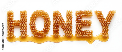 HONEY Typography with Honeycomb and Golden Drip on White Background © Emanuel