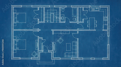 Detailed blueprint of a residential house floor plan showing multiple rooms and architectural layout.