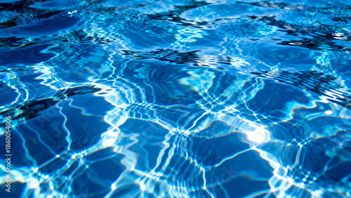 Sunlight reflecting on rippling blue water surface