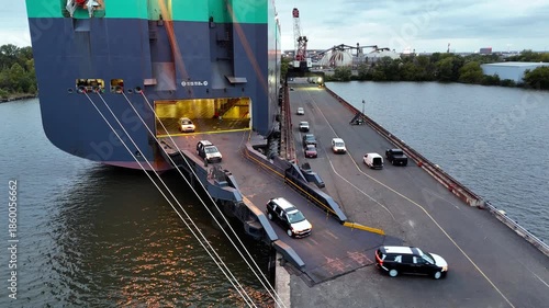 Aerial View of a Vehicle Car Carrier Ship Unloading Cars in Port
