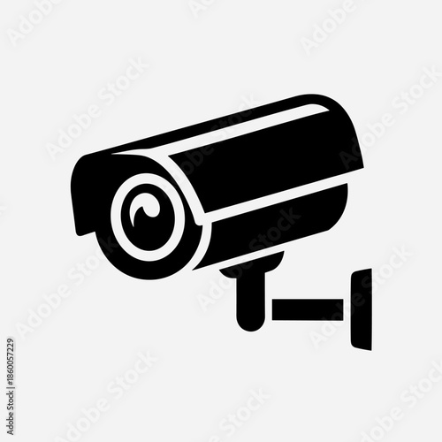 Black Security Camera Icon Mounted on Wall for Surveillance and Protection