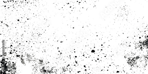 A grunge stark textured background featuring scattered black specks and smudges on a predominantly white surface