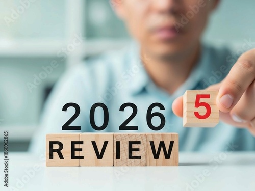 Business Review 2025 Turning Into 2026 on Wooden Blocks for Strategic Planning