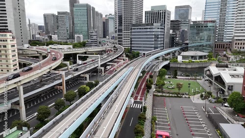 Yurikamome Train Moving Along Tokyo Bay Approaching Shiodome Skyscrapers