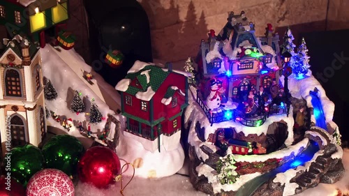 New Year Concept with Sliding Figures on Snow Track and Spinning Toy Train