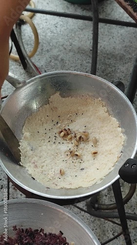 Wallpaper Mural On December 29, 2025, at a street food market in Nakhon Si Thammarat province, Thailand, a unique dessert was being sold: thin sheets of sticky rice mixed with coconut milk, grilled over fire, and top Torontodigital.ca