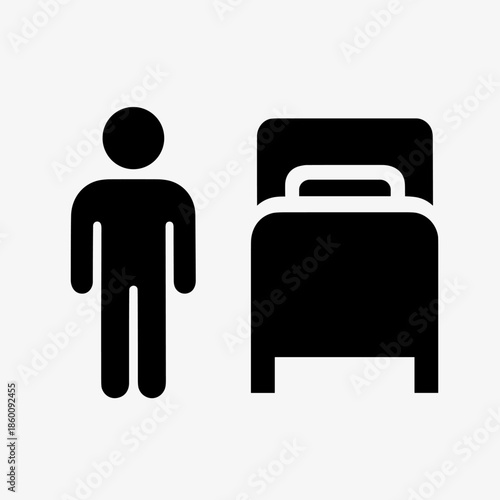 Simple Black Icon of a Person Standing Next to a Bed