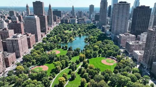 Aerial view of central park in new york city with surrounding skyscrapers, 4k