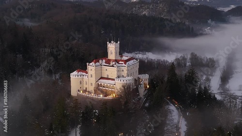 Aerial Golden Hour Winter Video of Trakošćan Castle, Snowy Castle at Sunset in Croatia