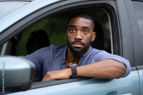 Confused Man Looking Out of Car Window - Portrait