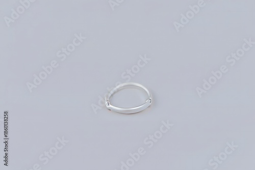 Minimalist Silver Band Ring on White Background