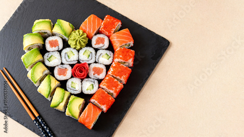 Heart-Shaped Sushi Platter for a Romantic Meal. Sushi on beige background, top view, text space