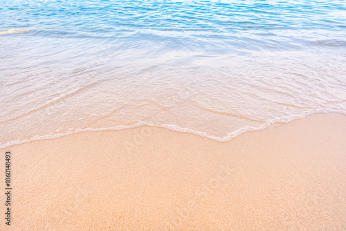 Canvas Print Soft blue ocean waves gently lapping onto a pristine tropical sandy beach