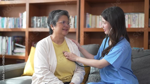 Wallpaper Mural Caregiver helps elderly woman with personal care at home Torontodigital.ca