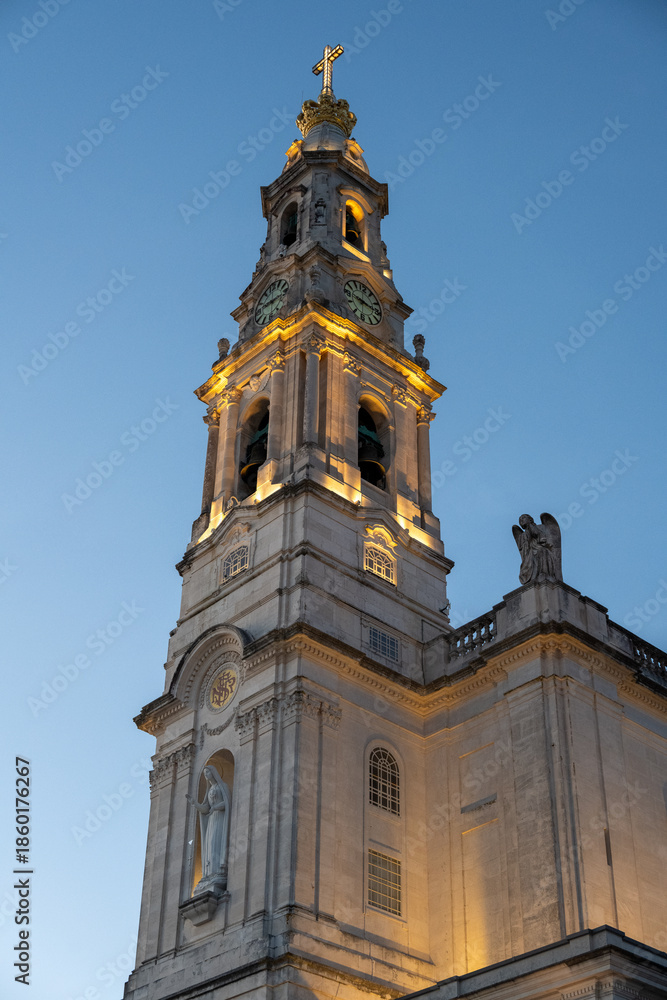 Fototapeta premium Illuminated church tower at dusk