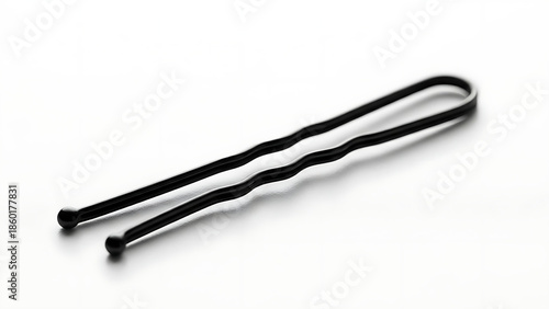 Simple Black Bobby Pin for Hair Styling and Accessories on a White Background