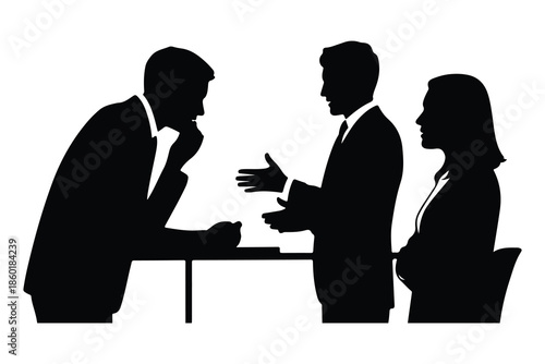 Four people in business attire discussing around a table