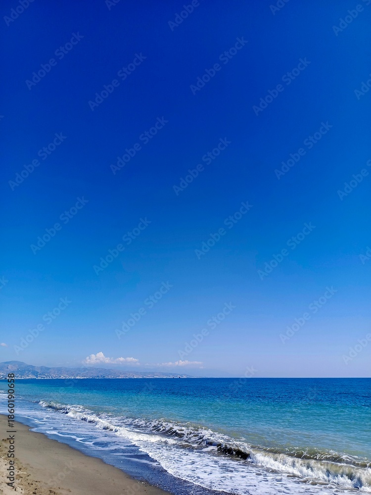 Fototapeta premium Beautiful sandy beach on a background of the sea and blue sky
