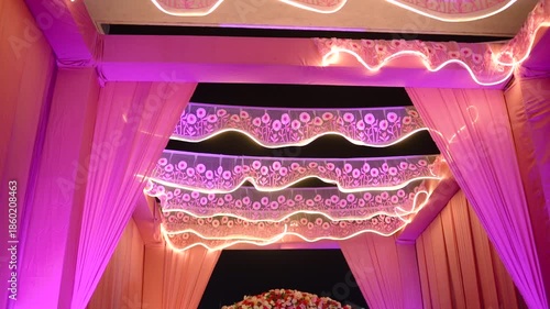 Beautifully decorated wedding venue featuring elegant floral arrangements, soft ambient lighting, and luxurious table settings