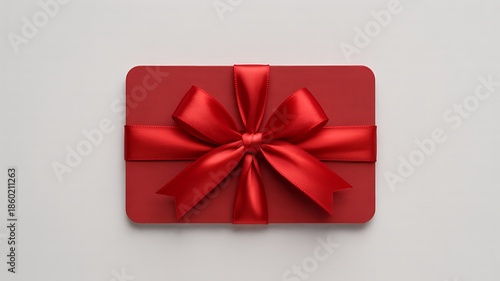 A professionally photographed gift card with a red ribbon on a plain white background