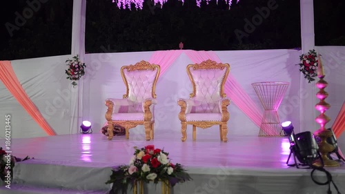 Beautifully decorated wedding venue featuring elegant floral arrangements, soft ambient lighting, and luxurious table settings